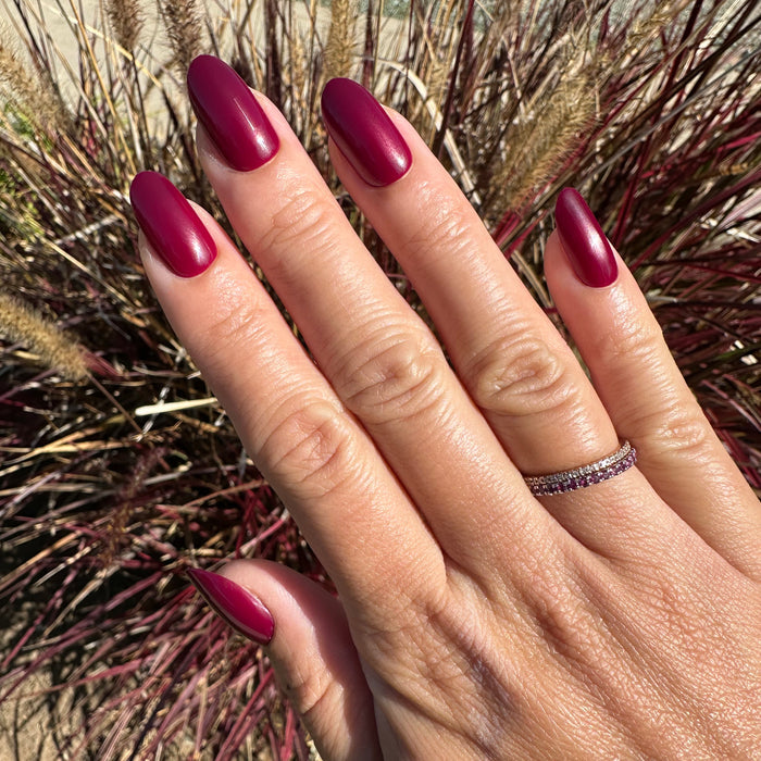 Cabernet | Medium | Oval - Tab Press-On showing matte dark plummy wine red medium oval press-on nails for easy at home mani