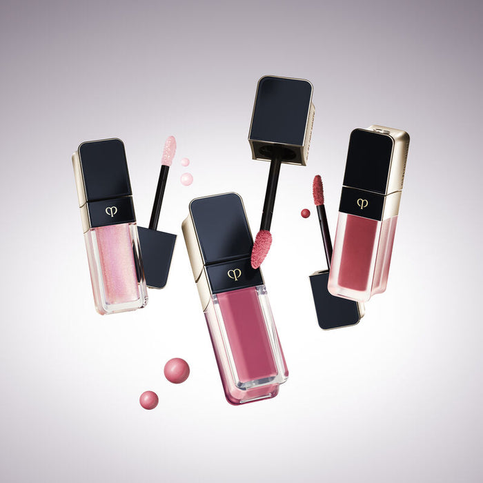 CLÉ DE PEAU BEAUTÉ Cream Rouge Matte Liquid Lipstick in Strawberry Rhubarb, new unopened, with bright red liquid lipstick applicator
