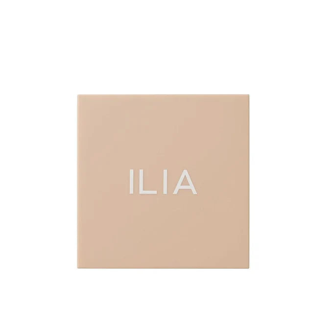 Ilia Nightlite Bronzing Powder in Songbird, closed compact with a sleek black finish, for natural sun-kissed glow.