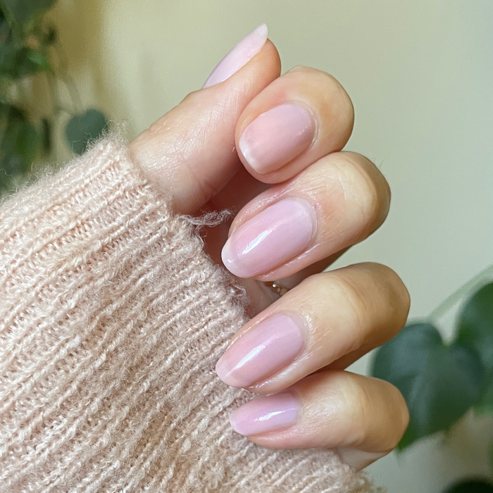 Kiss of Chrome quick dry polish on natural nails with a pearly sheer finish for a glossy at-home manicure