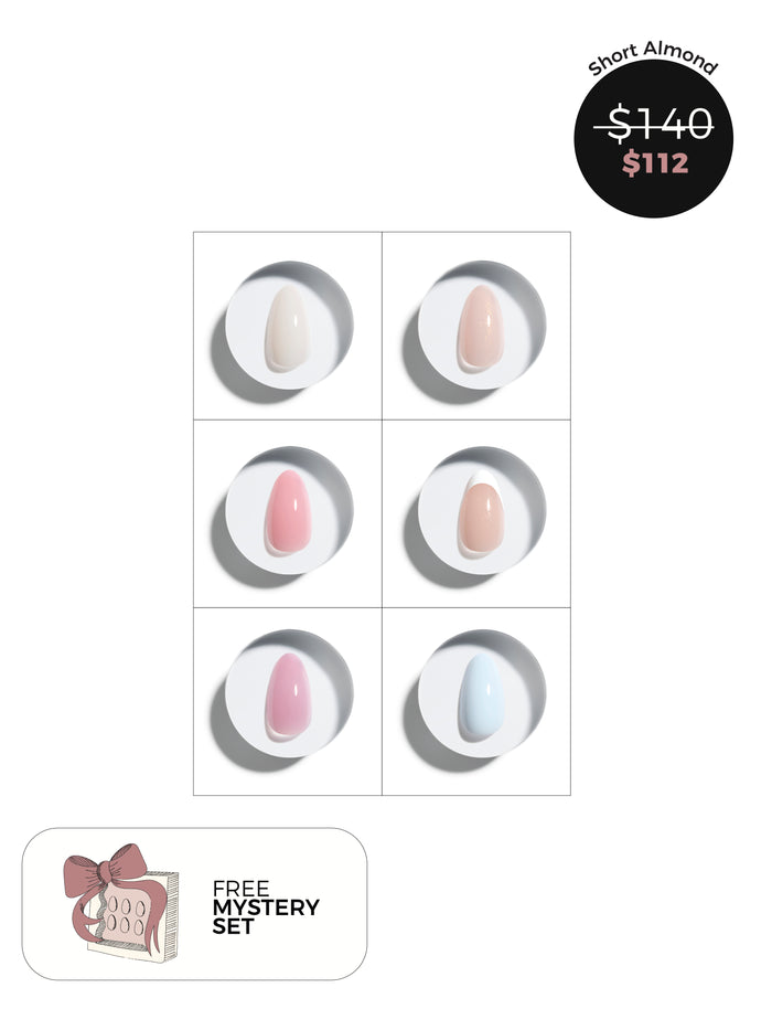 Short almond press-on nails with six colors displayed on a white background, including a free mystery set offer.
