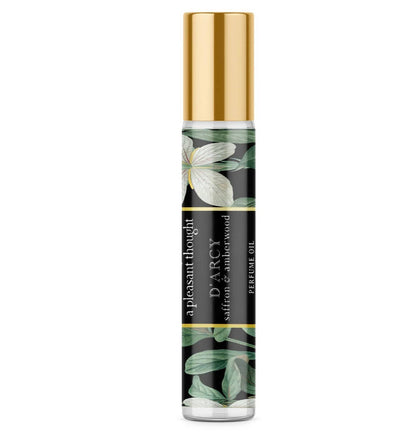A Pleasant Thought D'ARCY perfume oil with saffron and amberwood, featuring a sleek glass bottle and elegant design.