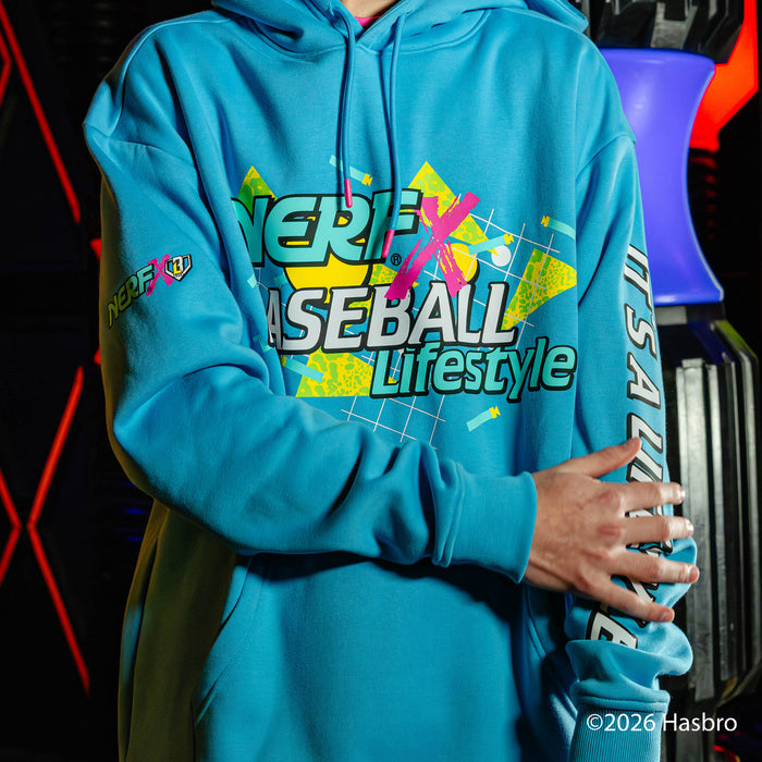 Person wearing a blue hoodie with colorful NERF X Baseball Lifestyle text and graphics, standing against a dark background.