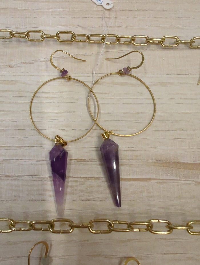 Large amethyst prism hoop earrings by Skipping Stones Jewelry, featuring vibrant purple gemstones and silver hoops.