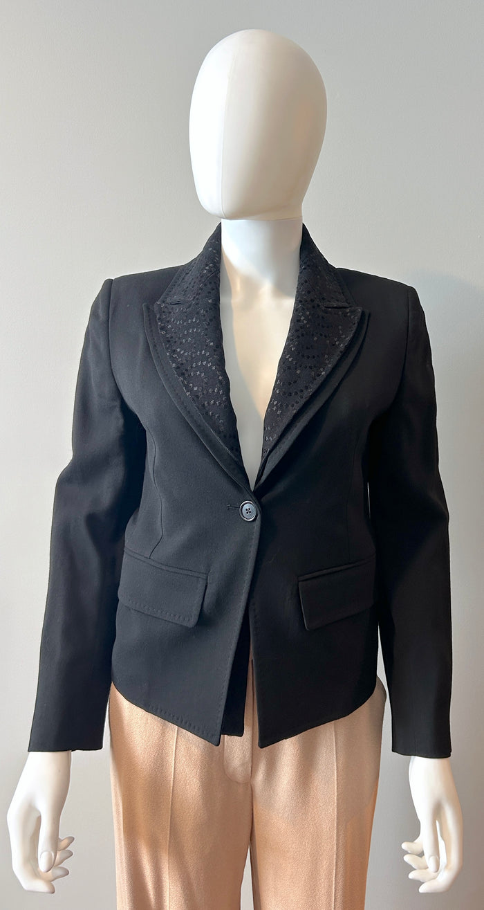 Black Ann Demeulemeester 2-way blazer in size 34/2, tailored fit, with lapels and structured design, displayed on a hanger.