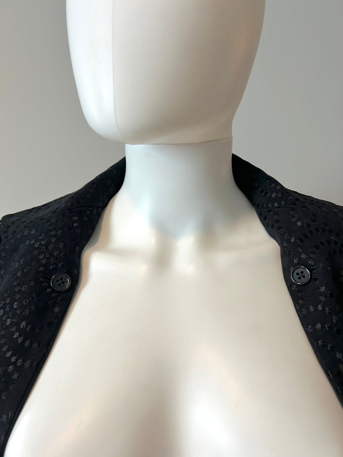 Ann Demeulemeester black two-way blazer in size 34/2, tailored fit, with classic lapels and sleek design.