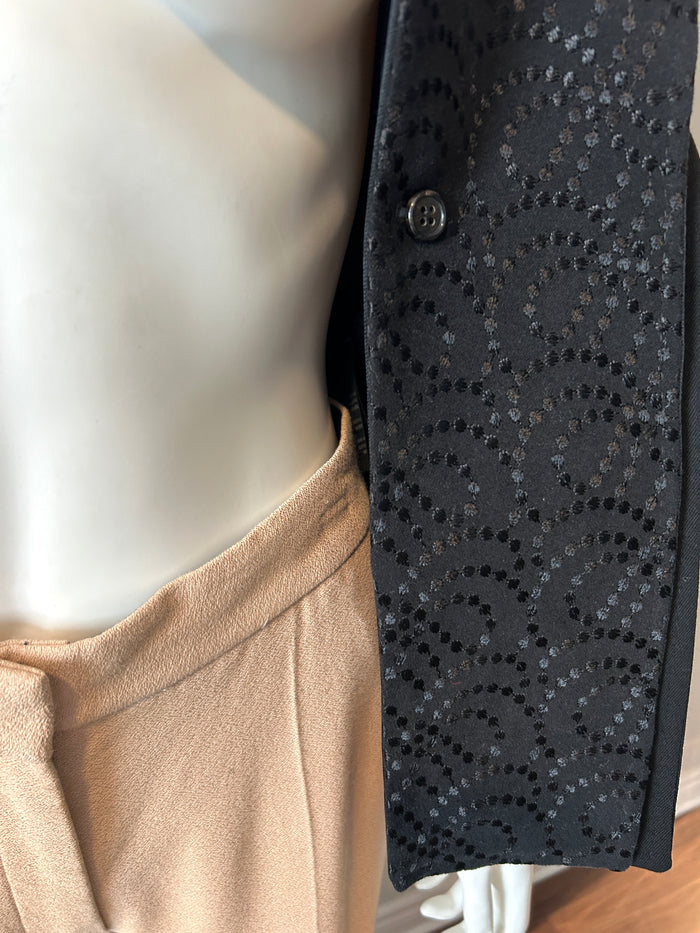 Ann Demeulemeester black two-way blazer in size 34/2, tailored fit, with lapel collar and sleek design, worn on a model.