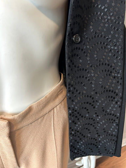Ann Demeulemeester black two-way blazer in size 34/2, tailored fit, with lapel collar and sleek design, worn on a model.