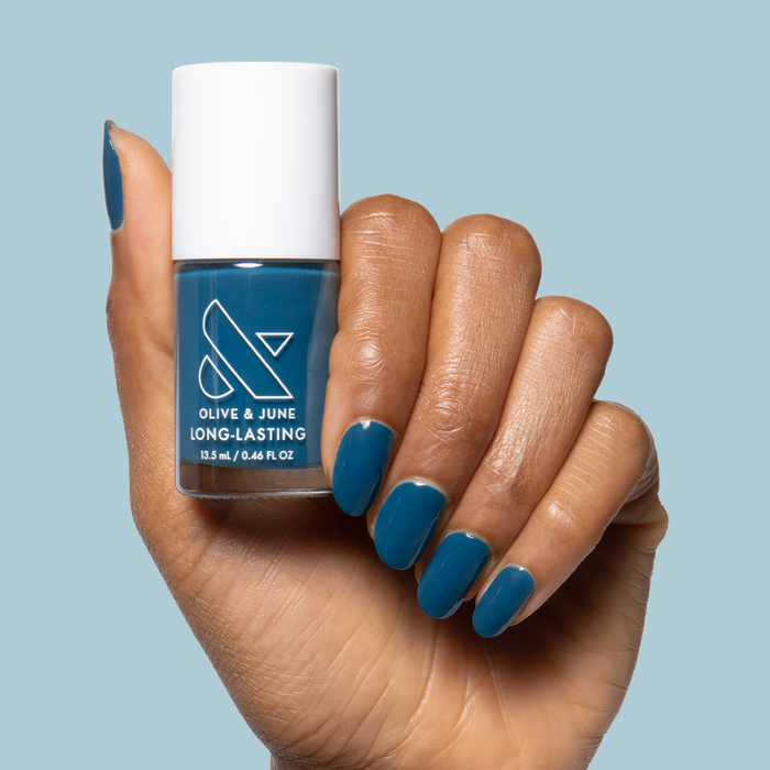 Après Mani deep teal green gel polish on nails for a stylish, long-lasting at-home manicure by Olive and June