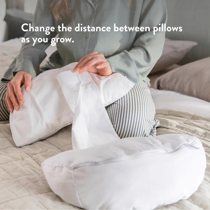 Change the distance between the pregnancy pillows as you grow.