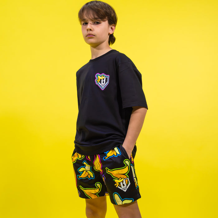 Adult model wearing black Banana Neon shorts