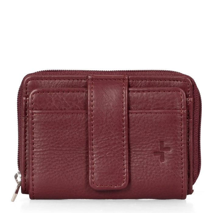 Front side of a burgundy card holder called basics by tracker, showing its 2 front card slots and closure strap.