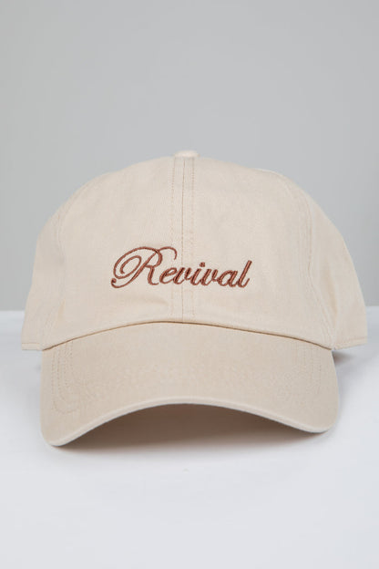 Beige cap with 'Revival' embroidery on a light gray background