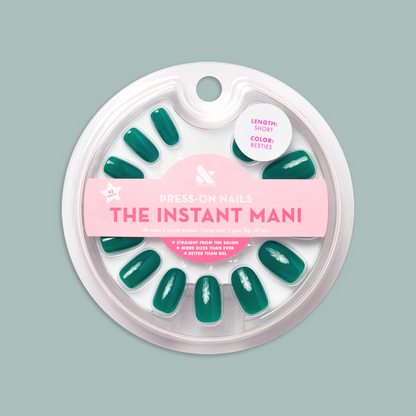Besties - Press-On | Short | Round showing deep emerald green short round press-on nails in circular clear case