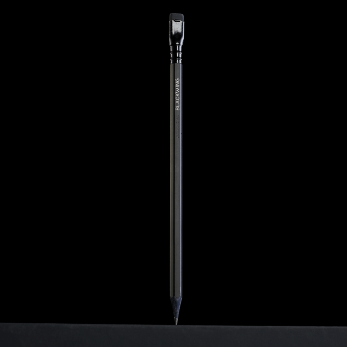 all black pencil standing up-right