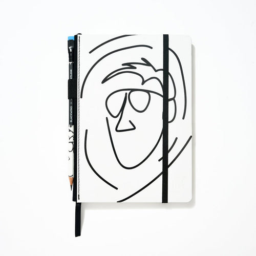 Blackwing x AEW "Freshly Squeezed" Orange Cassidy Notebook with a minimalist black line drawing of a face on a white cover