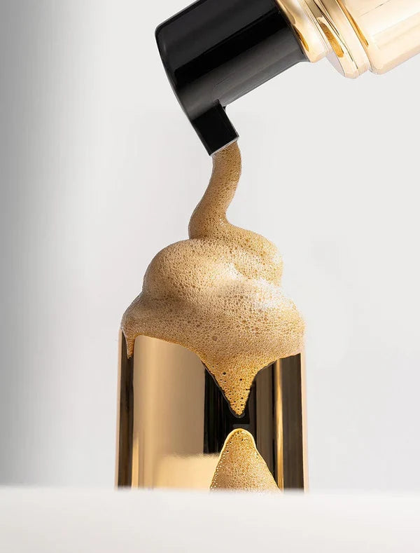 Bondi Sands self tanning foam bottles in three shades, showing the product's smooth foam texture and colorful packaging.
