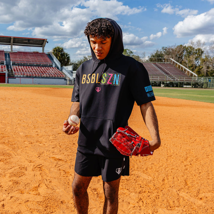 Adult model wearing black and midnight sundae BSBL-SZN short sleeve hoodie