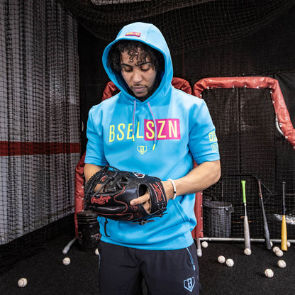 Adult model wearing pink BSBL-SZN Highlighter Blue short sleeve hoodie
