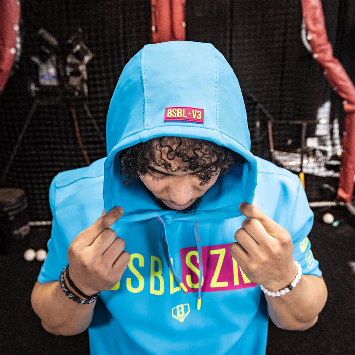 Adult model wearing pink BSBL-SZN Highlighter Blue short sleeve hoodie