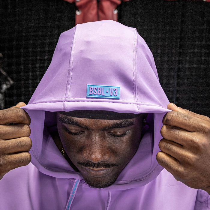 Adult model wearing lavender and light blue BSBL-SZN short sleeve hoodie