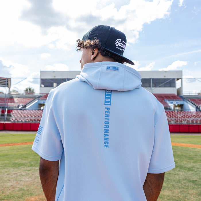 Adult model wearing powder blue and wavy BSBL-SZN short sleeve hoodie