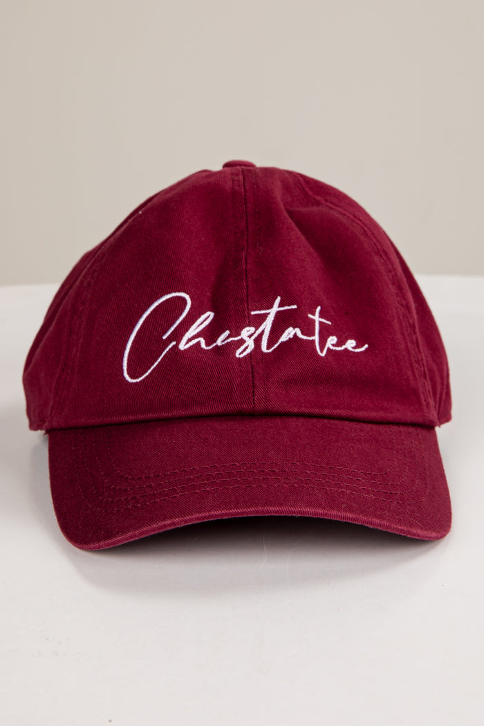 Maroon cap with 'Chestatee' embroidered on a white surface