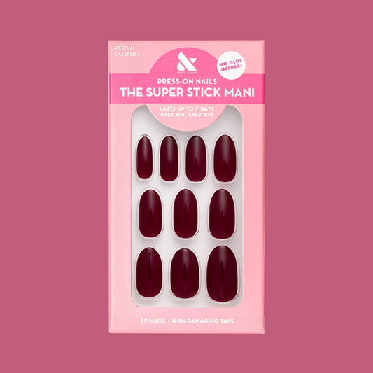 Cabernet | Medium | Oval - Tab Press-On showing deep plummy red medium oval false nails with easy no-glue application packaging