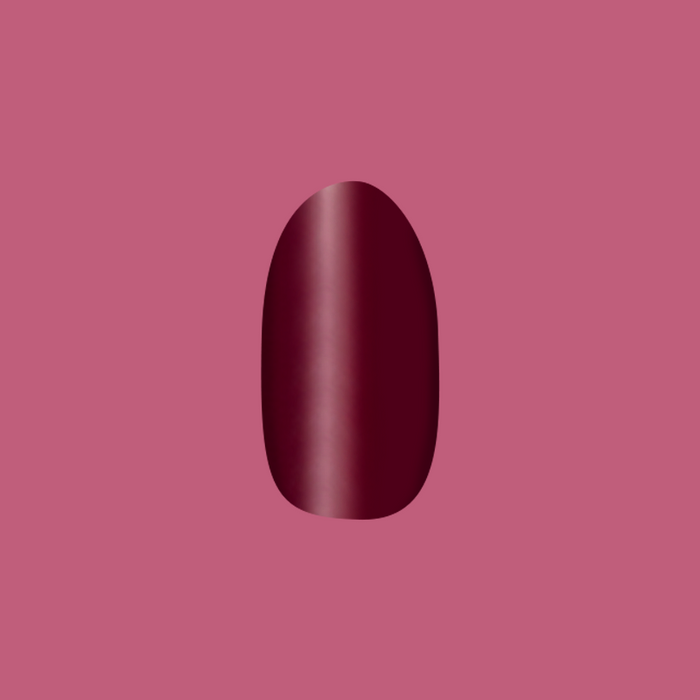 Cabernet | Medium | Oval - Tab Press-On showing a smooth dark plummy red oval false nail for easy at home manicure