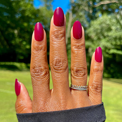 Cabernet | Medium | Oval - Tab Press-On showing medium oval nails in rich dark plummy red perfect for at home mani