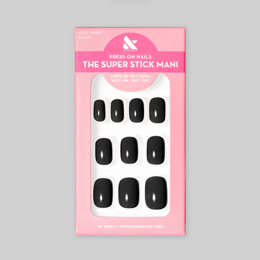 Cateye | Extra Short | Squoval - Tab Press-On nails in glossy solid black displayed in pink packaging with 32 nails and non-damaging tabs