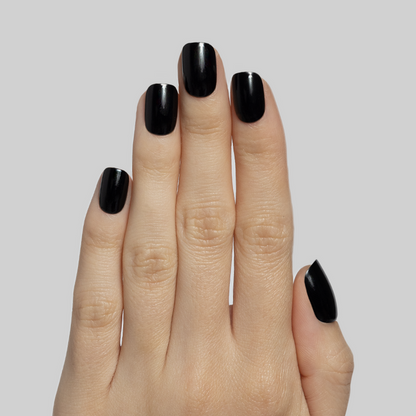 Cateye | Extra Short | Squoval - Tab Press-On nails in glossy solid black for easy at-home mani application
