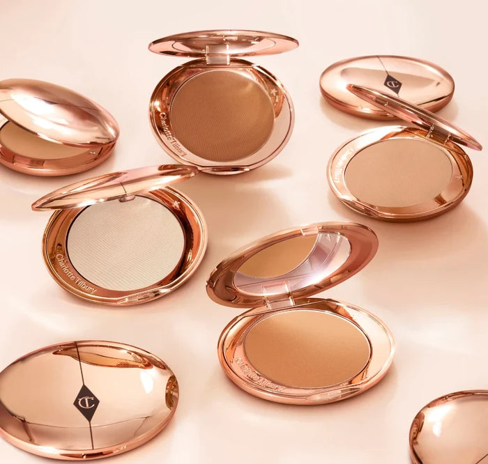 Charlotte Tilbury Airbrush Flawless Finish Setting Powder in 3 Tan, loose, finely milled powder in a sleek compact.