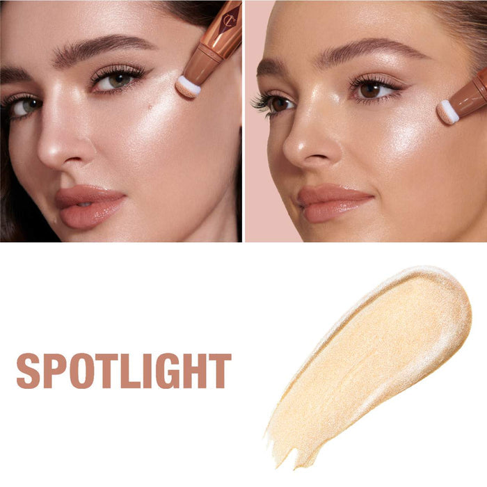 Charlotte Tilbury Beauty Highlighter Wand in Spotlight, showing the sleek packaging and applicator for radiant glow.