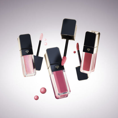 CLÉ DE PEAU BEAUTÉ Cream Rouge Matte Liquid Lipstick in Strawberry Rhubarb, new unopened, with bright red liquid lipstick applicator