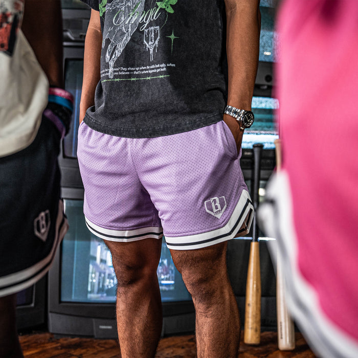 Adult model wearing purple Court Lavender shorts