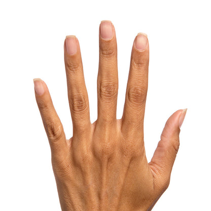 Hand showing natural nails with Crystal clear glossy polish on a white background for a shiny manicure look