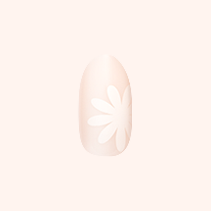 Daisy Pop | Medium | Oval - Tab Press-On showing neutral medium oval nail with large white daisy design for at home mani