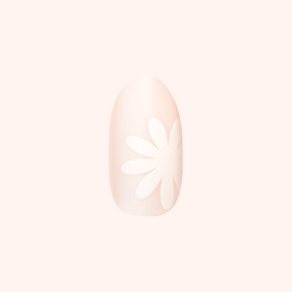Daisy Pop | Medium | Oval - Tab Press-On showing neutral medium oval nail with large white daisy design for at home mani