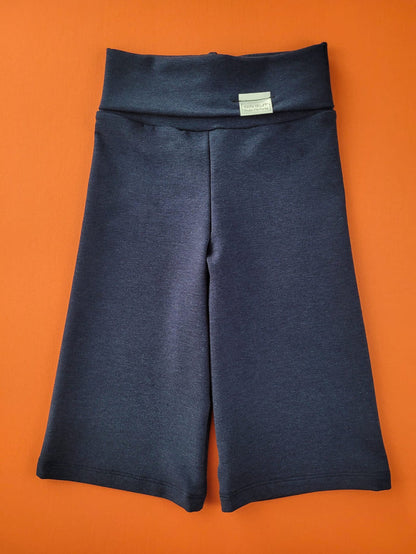 Eco-friendly kids' clothing – gender-neutral navy wide leg pants grow-with-me pants, sustainably made in Canada.