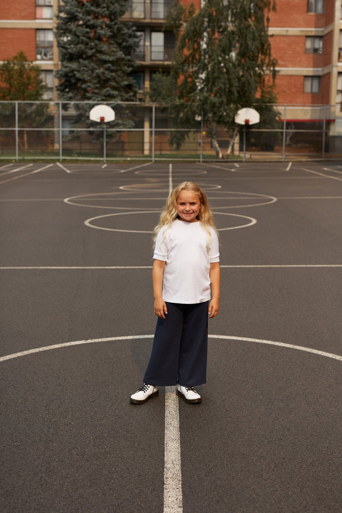 Eco-friendly kids' clothing – gender-neutral navy wide leg pants grow-with-me pants, sustainably made in Canada.
