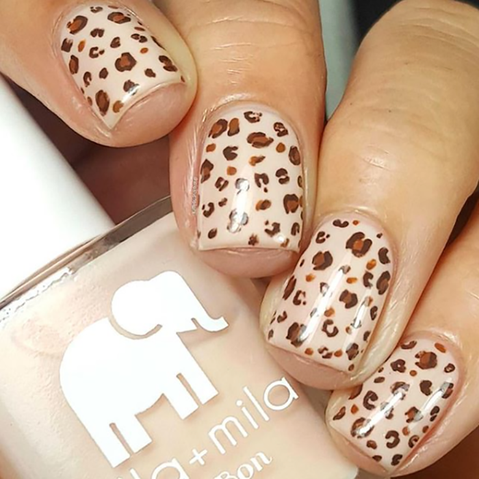 Dessert Island nude nail polish with leopard-print nail art and the bottle