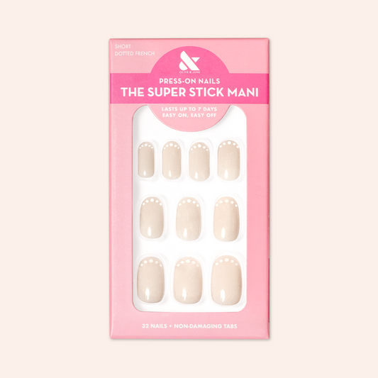 Dotted French | Short | Round - Tab Press-On neutral press-on nails with chic white dot French manicure in pink packaging