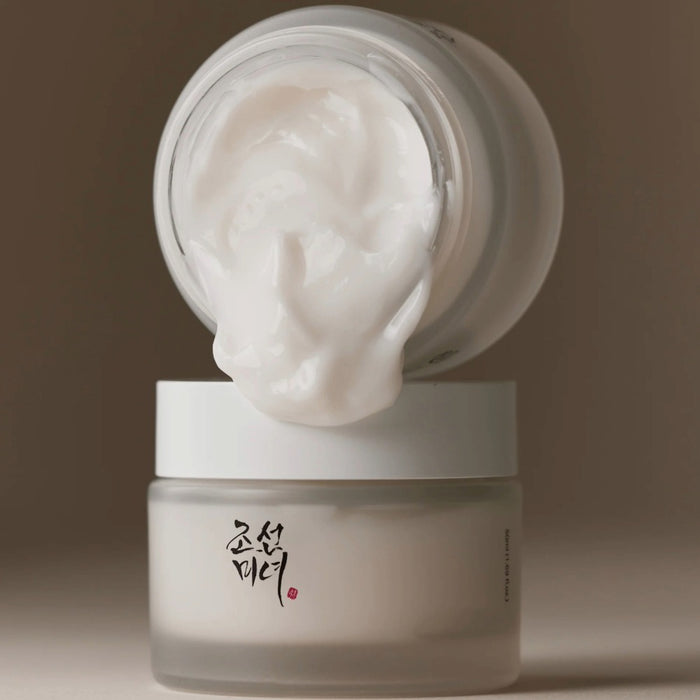 Beauty of Joseon Dynasty Cream moisturizer in frosted jar with creamy white texture spilling from open lid Korean herbal skincare