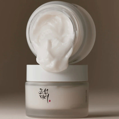 Beauty of Joseon Dynasty Cream moisturizer in frosted jar with creamy white texture spilling from open lid Korean herbal skincare