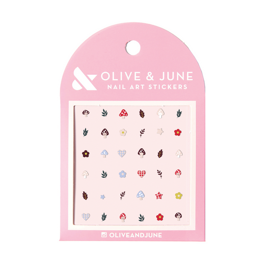 Fall Elements nail art stickers featuring small mushrooms, leaves, and flowers on pastel pink backing from Olive and June