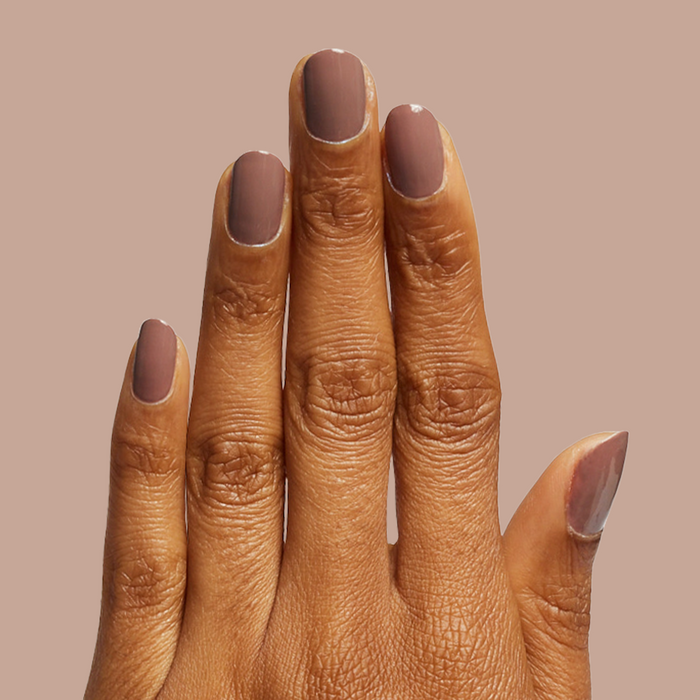 Hand with Fawn gel polish in a soft brown neutral shade for a smooth, long-lasting fall manicure look