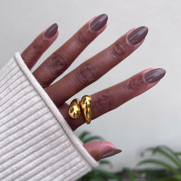Hand with Fawn gel polish in a muted brown neutral featuring a glossy finish for an easy at-home manicure look