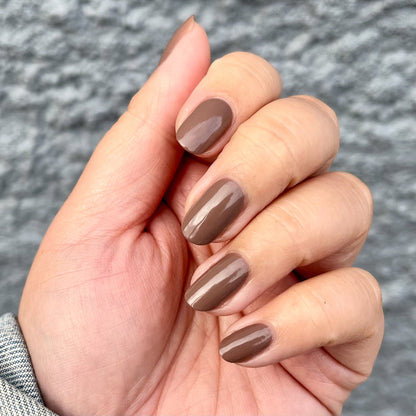 Hand with Fawn gel polish in soft minky brown neutral for a smooth, fall-inspired long-lasting mani at home