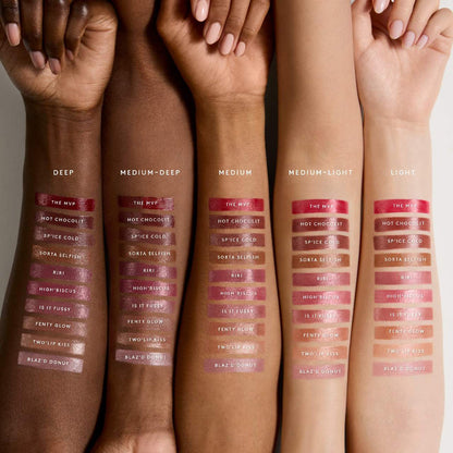 Fenty Beauty Gloss Bomb Stix high-shine gloss sticks in various shades, featuring vibrant colors and sleek packaging.